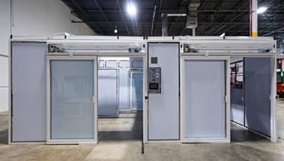 Modular cleanroom with dual automatic sliding door entries