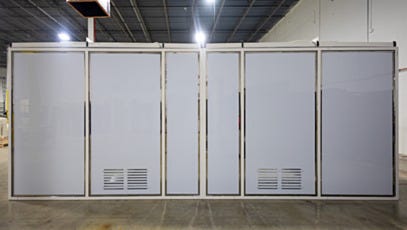 Modular cleanroom front view with solid wall panels and vent louvers