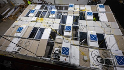 Overhead view of modular cleanroom showing ceiling grid with fan filter units