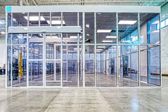 Automatic double sliding door entry on hardwall modular cleanroom with WhisperFlow FFU header