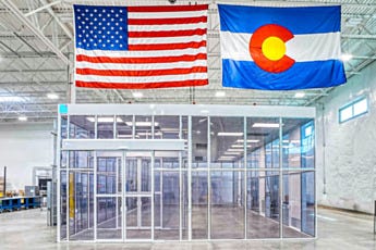 Full exterior of large hardwall modular cleanroom with static-dissipative PVC panels in industrial facility