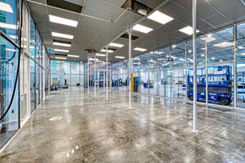 Open interior of hardwall modular cleanroom with static-dissipative PVC panel walls and powder-coated steel ceiling grid