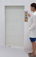 Installed roll up finished aluminum door with control panel