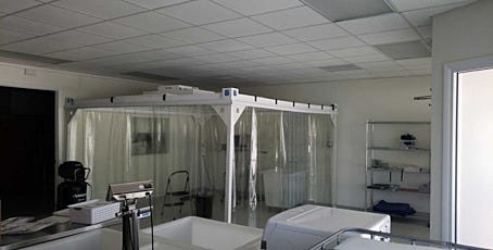 Portable softwall cleanroom with clear vinyl curtains for physics research