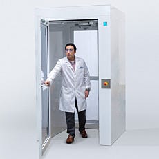 full view of air lock, door open with model walking out