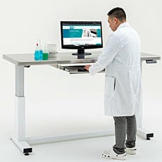 Stainless steel roll-out keyboard tray mounted to Terra cleanroom table