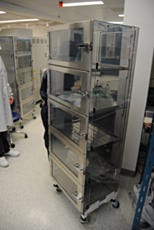 An SDPVC desiccator cabinet on a mobile stand for storing semiconductor chips and wafers