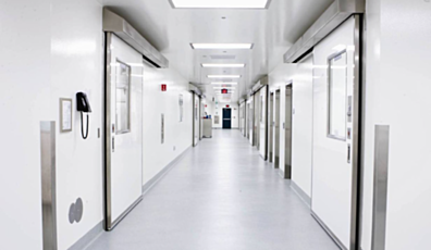 Single sliding cleanroom door with fiberglass panel and stainless steel hardware in real setting