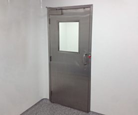 Single swinging stainless steel door in a real setting