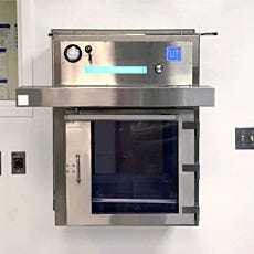 Pass through with HEPA FFU for transferring equipment into nuclear medicine labs
