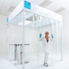 Laboratory Technician Inside Modular Softwall Cleanroom Installed Under Facility Drop Ceiling