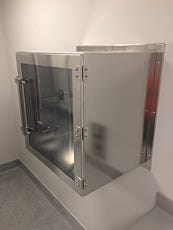 All-stainless steel pass-through chamber installed in a pharmacy wall