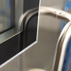 Custom black borders on flush-mounted tempered glass window