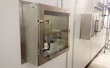 Stainless steel pass-through chambers installed in multi-suite cleanroom