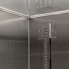 Close-up of seamless welded interior corner of stainless steel storage cabinet, highlighting crevice-free design for enhanced cleanliness in sterile environments.