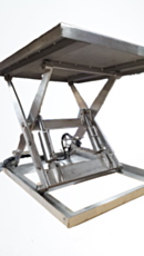 Stainless steel washdown lift table in raised position showing hydraulic cylinders and mechanism