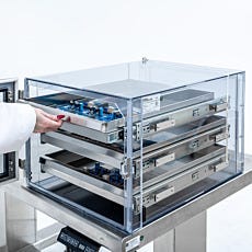 Static-safe desiccator with door open showing sliding storage trays