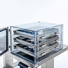 Static-safe desiccator with door open showing sliding storage trays