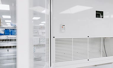 air conditioner unit inside of cleanroom with remote and panel