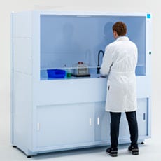 Image of the back of a model working within the ValuLine® wet bench