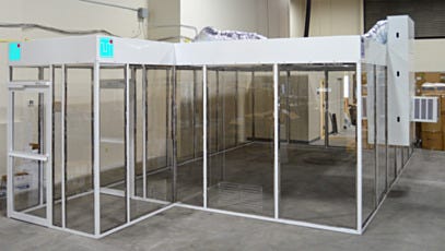 Exterior full view of hardwall ValuLine® cleanroom with double door and attached AC unit
