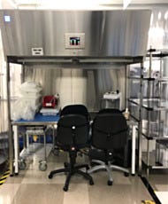 Stainless steel laminar flow hood over table in an optometry lab