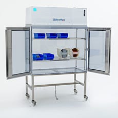Laminar flow hood with open doors showing storage containers on interior shelves