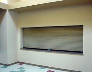 Wide counter fire-rated roll-up door with a closed door
