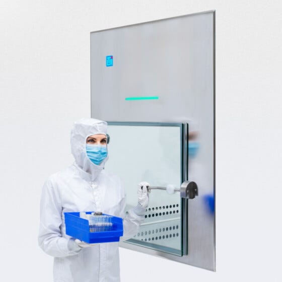 Smart BioSafe CleanMount pass-through with frameless glass door mounted in cleanroom wall