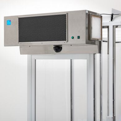 High-Velocity Cleanroom Air Curtain (stainless steel) shown installed on Terra’s Hardwall Cleanroom  |  6601-50A displayed
