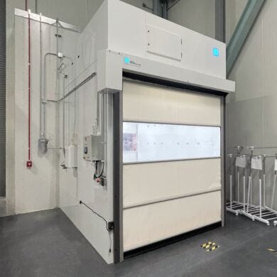 Roll-up door airshower with modesty panels designed for electric vehicle battery production  |  6010-54B displayed