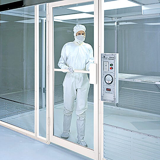 Swing door with powder-coated aluminum frame.