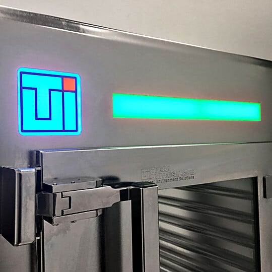Interlock status lights show green for disengaged (door available for use); red for engaged (door locked while opposite side is open)