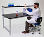 Epoxy resin top laboratory table with sturdy powder-coated steel base, shown with custom overhead shelf  |  2903-09 displayed