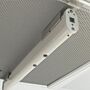 Ionizing bar, shown mounted to cleanroom ceiling fan/fitler unit, neutralizes surface charges to prevent electro-static discharge (ESD)