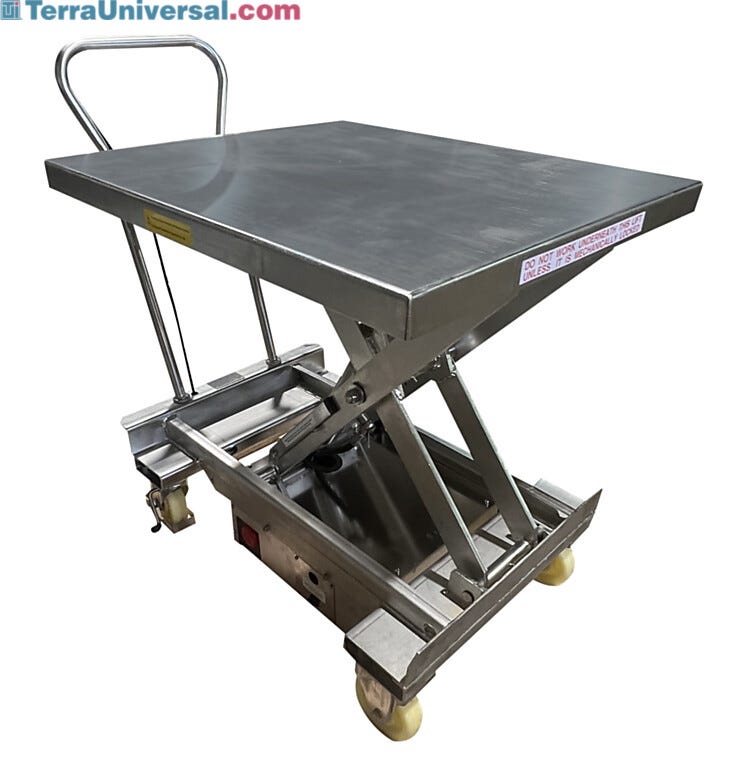 Stainless steel portable hydraulic lift table in raised position showing scissor mechanism, rectangular platform with safety labels, push handle, and mobile cas | 1735-08 displayed