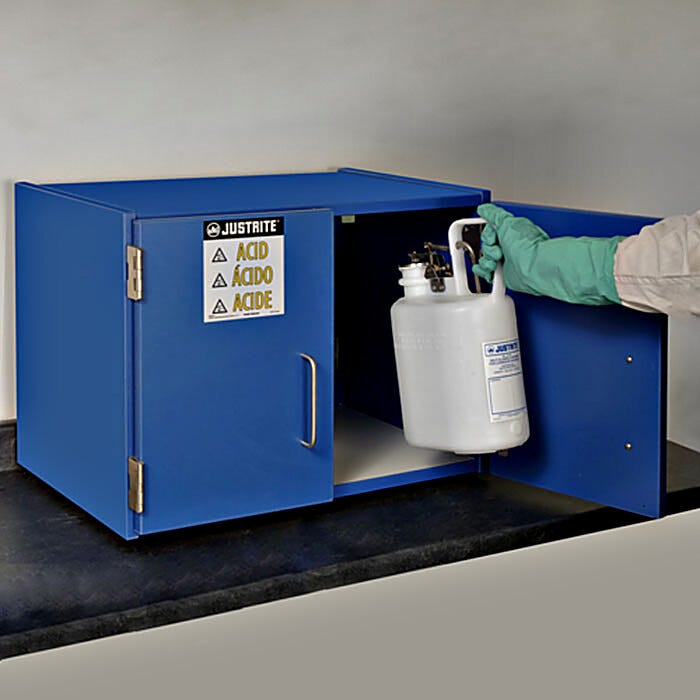 Countertop laminate storage cabinet holds small quantities of acids and corrosives, featured stainless steel hinges and handles resist corrosion