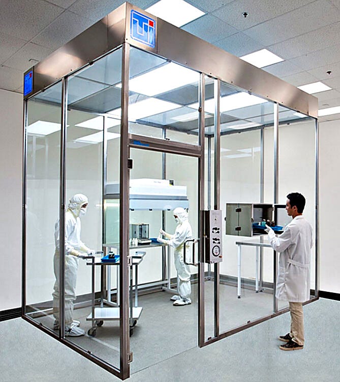 Free-standing ISO 7 modular hardwall clean room with tempered glass panels designed for power washing with cleaning chemicals  |  6600-69A displayed