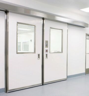 This cleanroom bi-parting door is designed with a tight-perimeter sealing system and exclusive interlocking center seal  |  6710-54 displayed