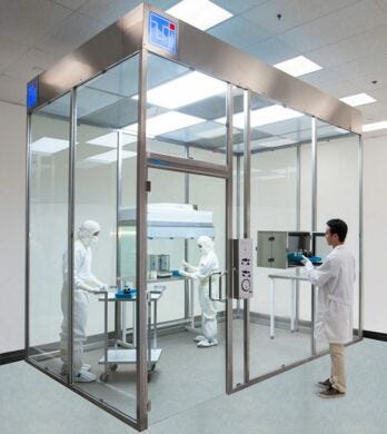 Free-standing ISO 7 modular hardwall clean room with tempered glass panels designed for power washing with cleaning chemicals  |  6600-69A displayed