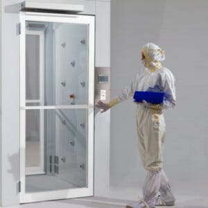 Powder-Coated Aluminum Automatic door opener with motion sensor allows hands-free door operation (shown installed above Air Shower entrance)