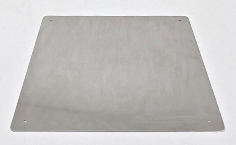 Stainless steel shield, installed on the floor of a plastic desiccator chamber, protects against scratching  |  1976-06 displayed