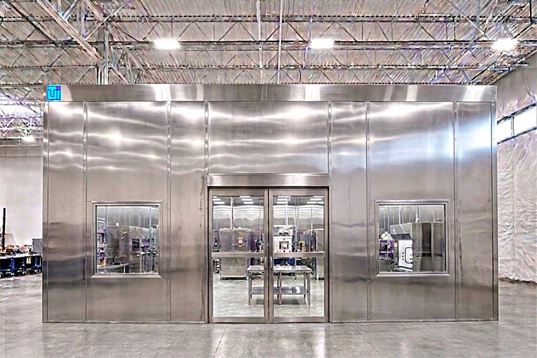 Custom Hybrid Universal® High Bay Cleanroom featuring stainless steel configurations for sensitive large-format manufacturing applications  |  6604-42 displayed