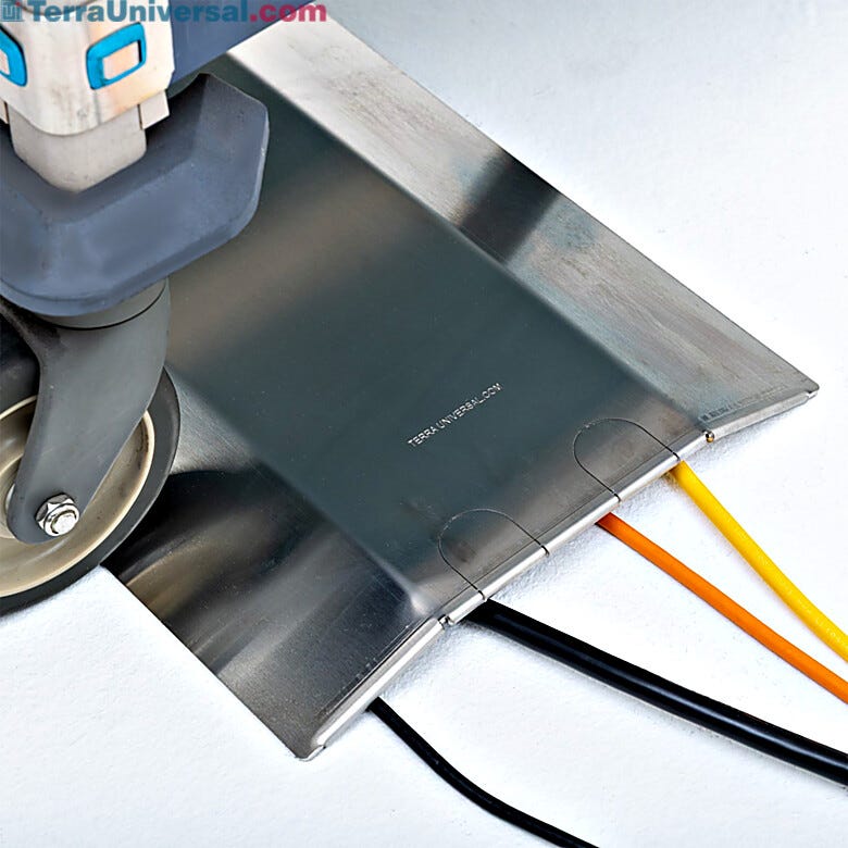 Stainless steel raceway with integrated cord slots organizes multiple electrical connections while protecting cables from damage.  |  1555-00 displayed