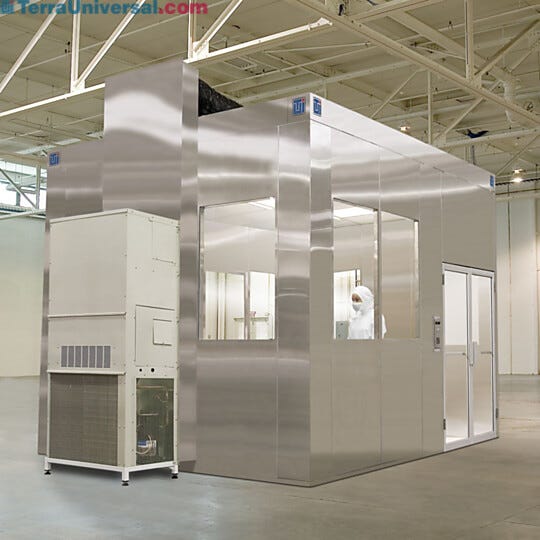 Air plenums can be added to all-steel BioSafe cleanrooms and ducted directly back into the fan/filter units (shown with integrated air conditioning unit)