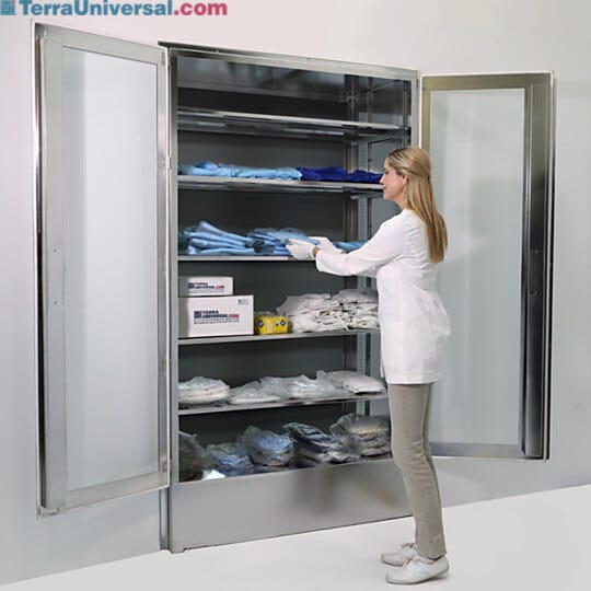 Recessed, aseptic, wall-mounted cabinet stores garments, consumables and supplies